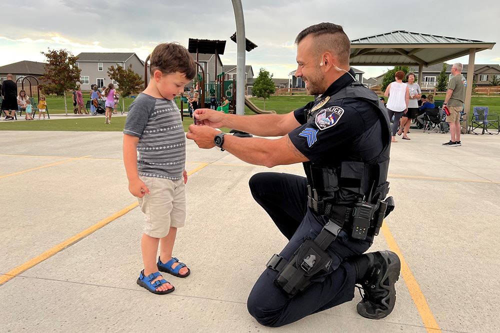 Officer and a boy during National Night Out 2022